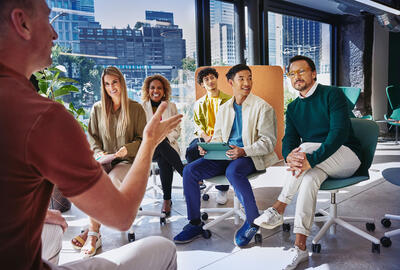 A group of colleagues talking to each other Randstad Professional Career